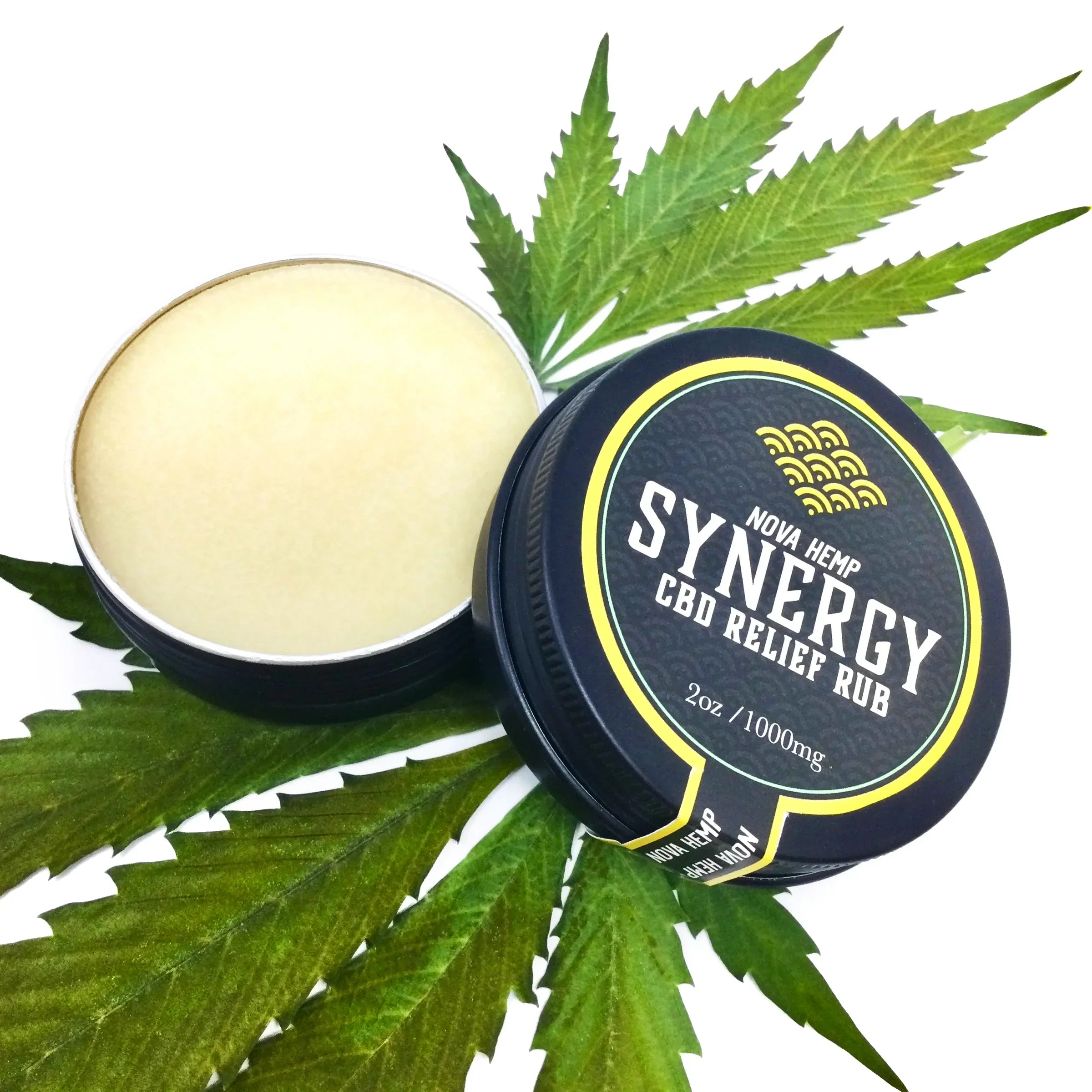A round black container of Synergy CBD relief rub, with a green leaf backdrop.